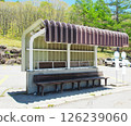 A bus shelter with a sturdy roof 126239060