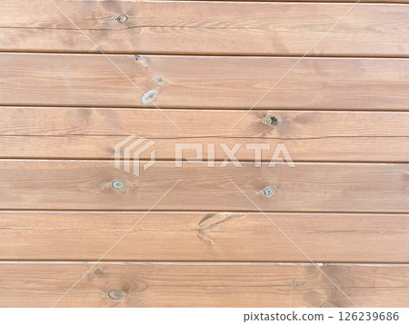 A background of wooden planks nailed to the wall 126239686