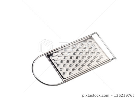 Metal grater for fruits and vegetables. Small holes and large ones. 126239765