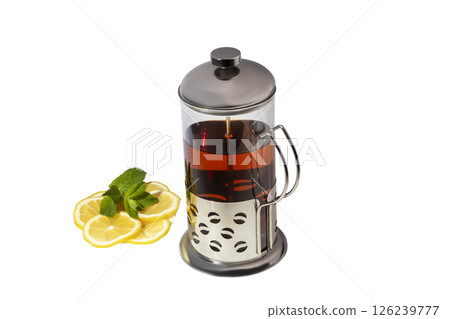Teapot with metal strainer inside. Kitchen utensils on gray background. Teapot with metal strainer inside. Kitchen utensils on gray background. 126239777