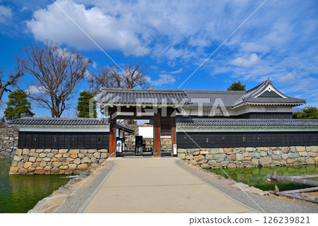 Matsumoto Castle, Chubu region, bridge at the entrance to the castle's viewing area and the gate of the viewing ticket office, with the Kuromon Gate behind it, Matsumoto City, Nagano Prefecture (11) 126239821