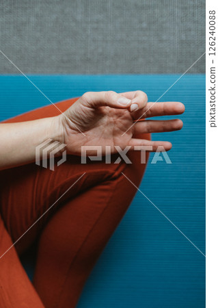 Meditative Hand Gesture on Yoga Mat 126240088
