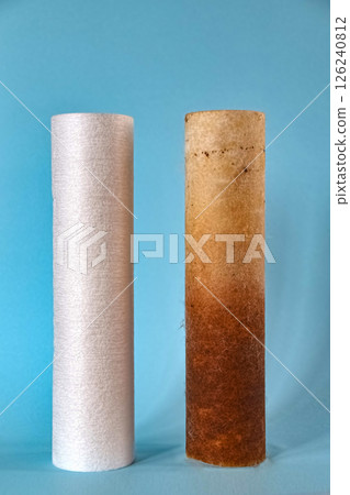 Ecology problems. Two water filters side by side - one dirty the other clean 126240812
