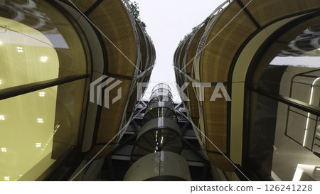 Modern building with wooden details and glass facade. Action 126241228