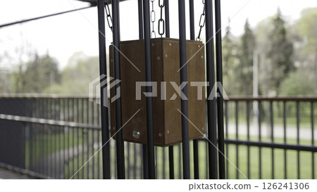 A wooden box stands out against metal surroundings, sparking curiosity. Creative 126241306