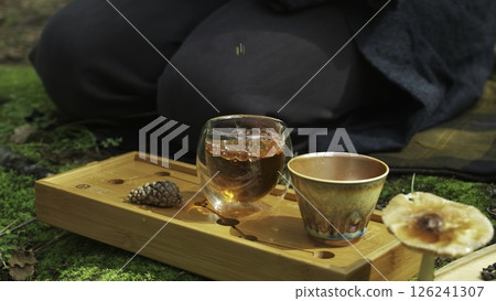 A serene video capturing relaxation moments with tea in nature. Media 126241307