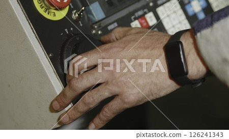 Operator is responsible for adjusting the machinerys intricate control panel settings. Media Operator is responsible for adjusting the machinerys intricate control panel settings. Media 126241343
