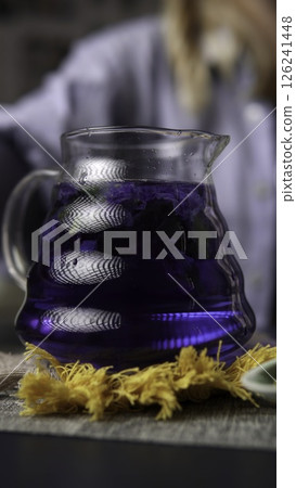 A Beautiful and Vibrant Blue Herbal Drink Served in a Glass Pitcher for Refreshment. Media 126241448