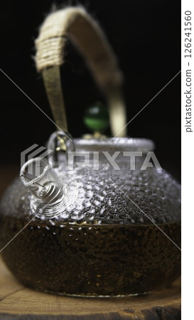 This is an Authentic Glass Teapot featuring Natural Details that enhance its beauty. Media 126241560