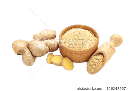 Ginger powder in bowl with fresh ginger root isolated on white background. Top view Ginger powder in bowl with fresh ginger root isolated on white background. Top view 126242367