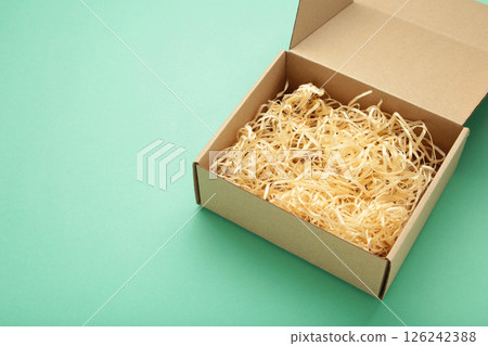 Brown Paper box Cardboard box on mint background Brown Paper box Cardboard box on mint background 126242388