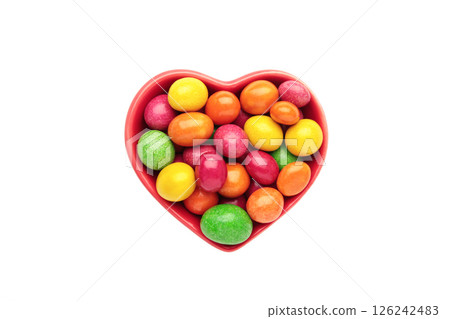 Chocolate covered balls isolated on white background. Colorful chocolate coated candies. Top view 126242483