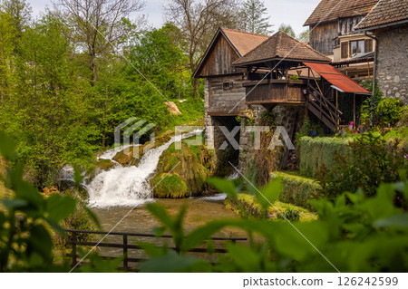 The historic village of Rastoke in the town of Slunj, where the Slunjcica River flows into the Korana River via cascades and waterfalls, Croatia 126242599
