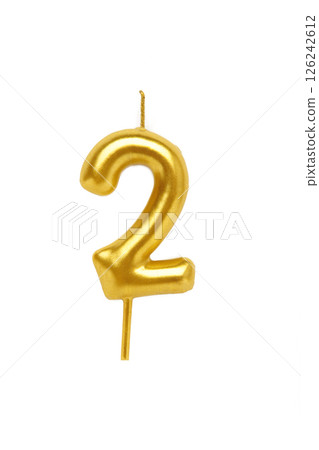Gold candle in the form of number two isolated on white background. 126242612