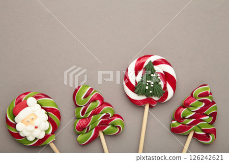 Christmas Candy on grey background. Sweet lollipop. 126242621
