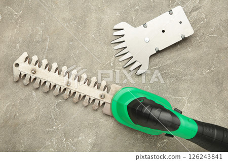 Hedge Trimmer New cordless hedge trimmer on grey concrete background 126243841