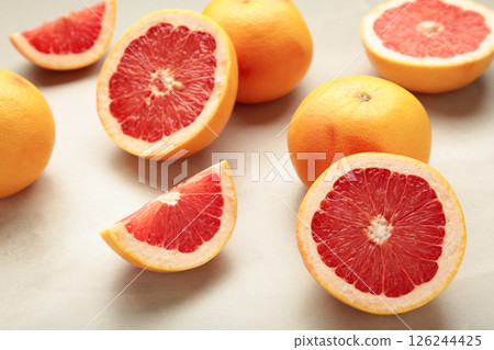 Fresh raw grapefruit on light background Fresh raw grapefruit on light background 126244425