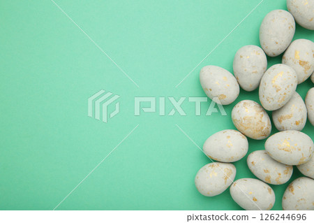 Easter eggs in a speck on mint background. Easter holiday composition. Space for text 126244696