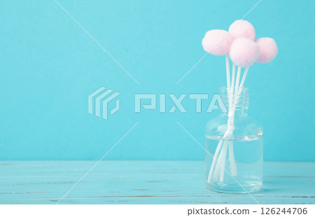 Air freshener on blue. White aroma diffuser bottle with sticks. Minimalism Air freshener on blue. White aroma diffuser bottle with sticks. Minimalism 126244706