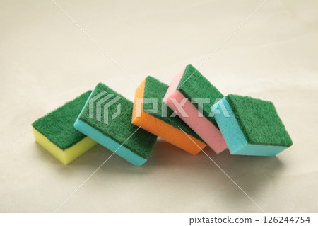 Sponge for dish cleaning on light background Sponge for dish cleaning on light background 126244754