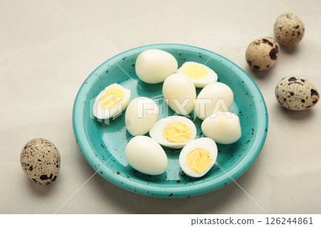 Boiled quail eggs on plate on light background. Easter Boiled quail eggs on plate on light background. Easter 126244861
