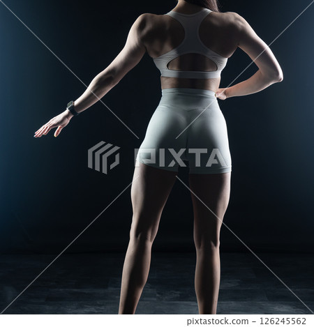 athletic female body on dark background, fitness woman, athletic girl torso athletic female body on dark background, fitness woman, athletic girl torso 126245562