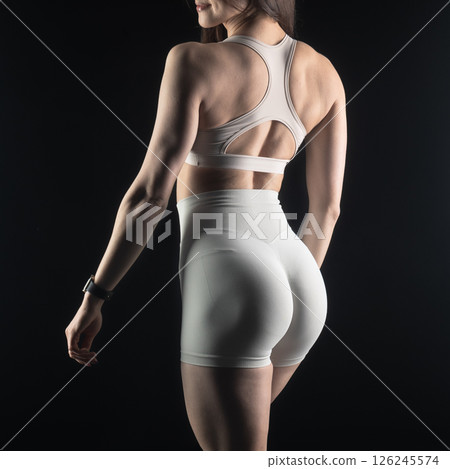 athletic female body on dark background, fitness woman, athletic girl torso athletic female body on dark background, fitness woman, athletic girl torso 126245574