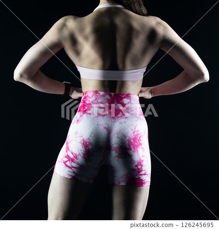 athletic female body on dark background, fitness woman, athletic girl torso athletic female body on dark background, fitness woman, athletic girl torso 126245695