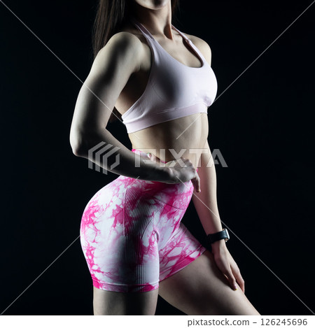 athletic female body on dark background, fitness woman, athletic girl torso 126245696