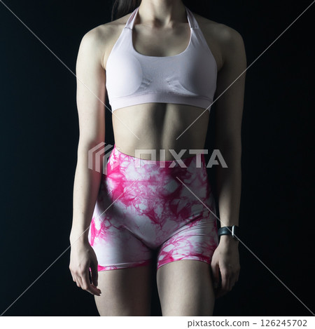 athletic female body on dark background, fitness woman, athletic girl torso athletic female body on dark background, fitness woman, athletic girl torso 126245702