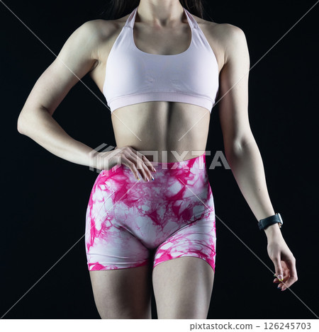 athletic female body on dark background, fitness woman, athletic girl torso 126245703