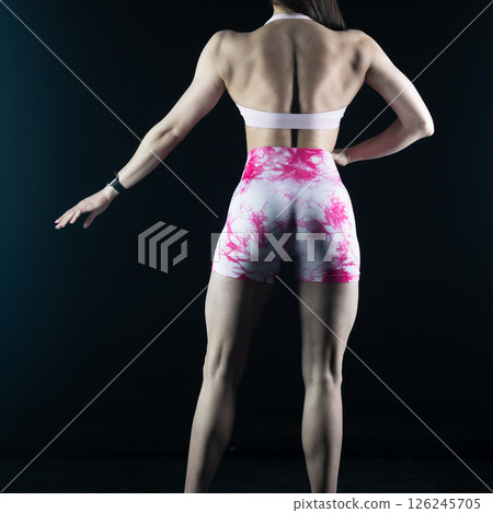 athletic female body on dark background, fitness woman, athletic girl torso 126245705