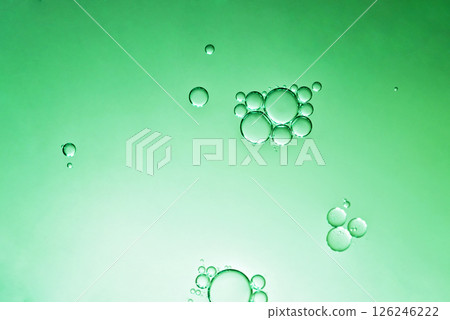oil with bubbles on green background. Abstract space background. Soft selective focus. macro of oil drops on water surface. copy space. air bubbles in water 126246222