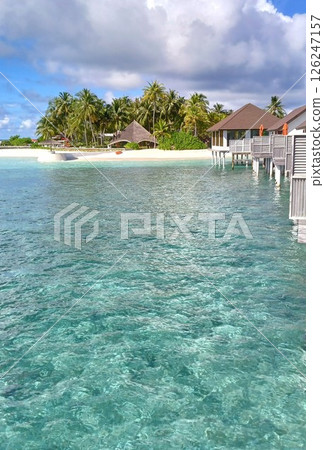 The Maldives, the pearl of the Indian Ocean, is a resort island surrounded by beautiful coral reefs and palm trees just below the equator. The Maldives, the pearl of the Indian Ocean, is a resort island surrounded by beautiful coral reefs and palm trees just below the equator. 126247157