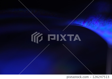 Deep purple liquid surface on black background, oil stains movement, bright chemistry, deep space background Deep purple liquid surface on black background, oil stains movement, bright chemistry, deep space background 126247513