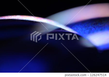 Deep purple liquid surface on black background, oil stains movement, bright chemistry, deep space background 126247514