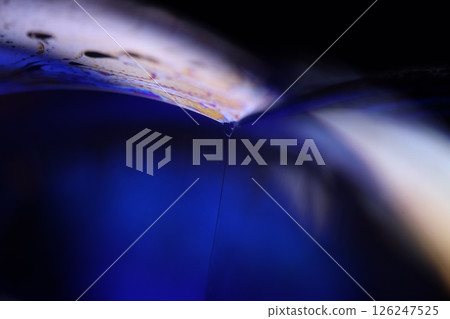 Deep purple liquid surface on black background, oil stains movement, bright chemistry, deep space background Deep purple liquid surface on black background, oil stains movement, bright chemistry, deep space background 126247525