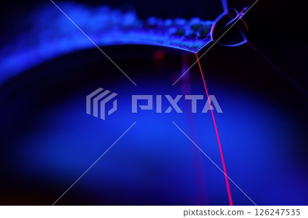 Deep purple liquid surface on black background, oil stains movement, bright chemistry, deep space background 126247535