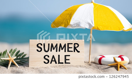 Beach umbrella, starfishes and summer sale sign on the sand 126247945