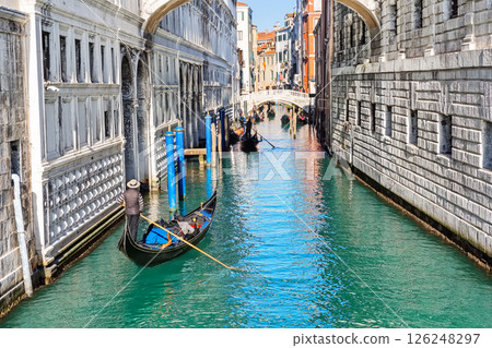 Gondolas floating under the bridge of Sighs (Ponte dei Sospiri) in Venice, Italy. Gondolas floating under the bridge of Sighs (Ponte dei Sospiri) in Venice, Italy. 126248297