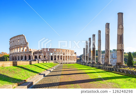 Road to Colosseum from Roman Forum in Rome, Italy. Ancient Roman ruins of Colosseum (Coliseum), landscape of old Rome city, Italy. Road to Colosseum from Roman Forum in Rome, Italy. Ancient Roman ruins of Colosseum (Coliseum), landscape of old Rome city, Italy. 126248298