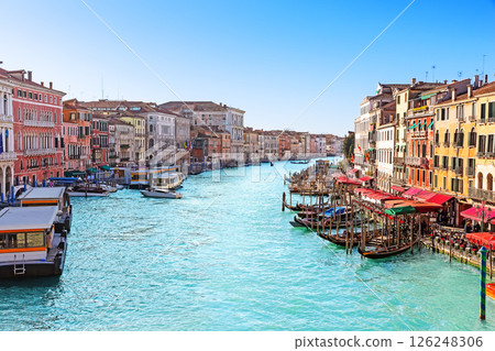 Beautiful view of the Grand Canal with palaces, gondolas and boats from the Rialto Bridge in Venice, Italy. Beautiful view of the Grand Canal with palaces, gondolas and boats from the Rialto Bridge in Venice, Italy. 126248306