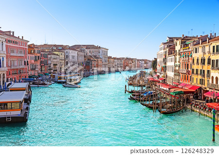 Beautiful view of the Grand Canal with palaces, gondolas and boats from the Rialto Bridge in Venice, Italy. Beautiful view of the Grand Canal with palaces, gondolas and boats from the Rialto Bridge in Venice, Italy. 126248329