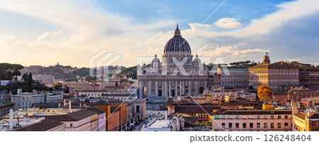 Panorama of Saint Peter Basilica in Vatican City at Rome, Italy and Street Via della Conciliazione at sunset sky. 126248404