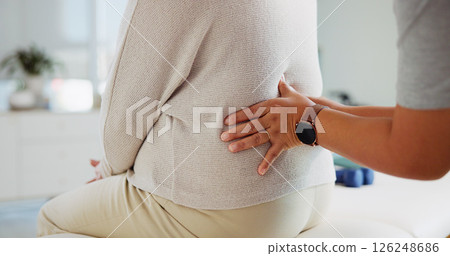 Physical therapy, back pain and hands of woman with patient for support, wellness and consultation. Healthcare, chiropractor and physiotherapist with person for osteoporosis, mobility or arthritis Physical therapy, back pain and hands of woman with patient for support, wellness and consultation. Healthcare, chiropractor and physiotherapist with person for osteoporosis, mobility or arthritis 126248686
