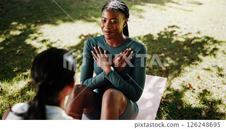 Women, personal trainer and sit up at park with exercise mat, support or training for strong core in summer. Girl, friends and workout for muscle, abs and fitness in nature with coach help in morning 126248695
