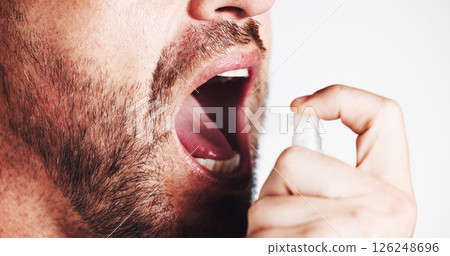 Hands, spray and mouth for breath in studio with oral wellness, hygiene and results by white background. Person, bottle and fresh with product for self care, scent and routine for dental health Hands, spray and mouth for breath in studio with oral wellness, hygiene and results by white background. Person, bottle and fresh with product for self care, scent and routine for dental health 126248696