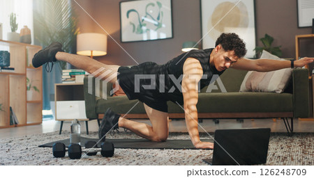 Stretching, laptop and man in home for exercise, workout and training for muscle strength on website. Sports, living room and person on computer for online tutorial, video and streaming for wellness 126248709