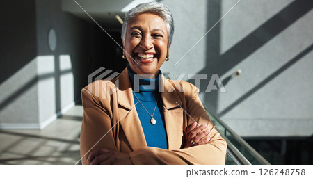 Smile, mature and confident business woman in company with experience as talent acquisition specialist. Arms crossed, professional and happy human resources manager in office in hallway in Mexico 126248758