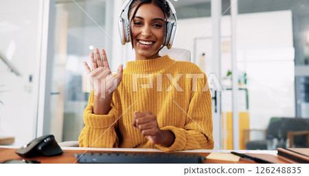 Woman, headset and video call at office with wave, review or talk for technical support at IT startup. Person, portrait or consultant for virtual advisory services, hello or help desk POV in Colombia 126248835